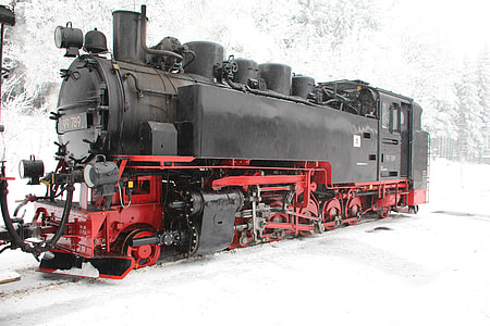 black and red train during snow thumbnail
