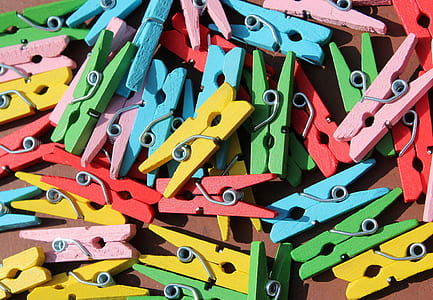 flat view of assorted-color wooden clothespin thumbnail