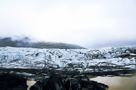 photo of ice near body of water thumbnail