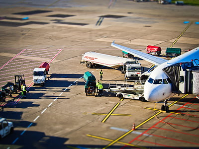 aerial photography of plane near vehicle at daytime thumbnail
