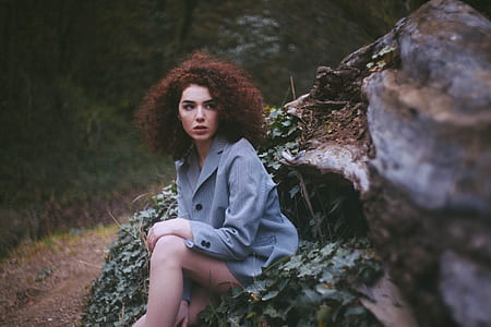 woman sitting on plant thumbnail