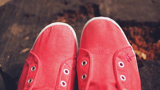 person wearing red low-tops thumbnail