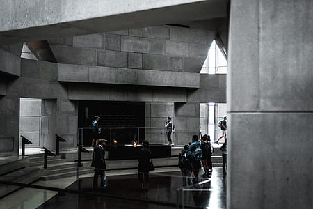 people inside grey building thumbnail
