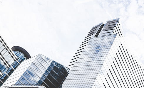 low-angle photo of glass buildings thumbnail