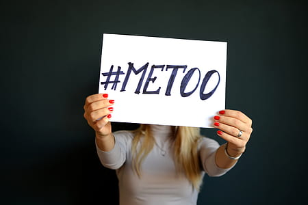 person holding a paper with #METOO text thumbnail