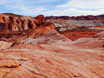 Brown and White Mountain Under Blue and Cloudy Sky thumbnail