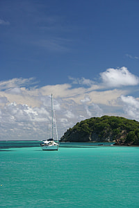 white sailboat on body of water thumbnail
