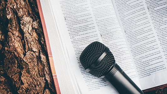 black microphone on book page thumbnail