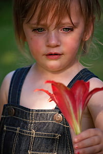 girl holding red lily flower thumbnail