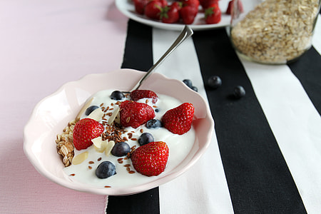 five strawberries on white ceramic plate thumbnail