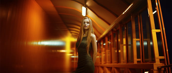 woman in black dress standing on isle thumbnail