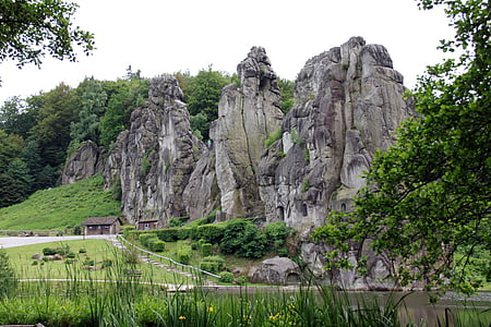 grey mountain under cloudy sky thumbnail