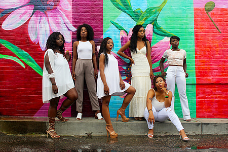 six woman near wall posting thumbnail