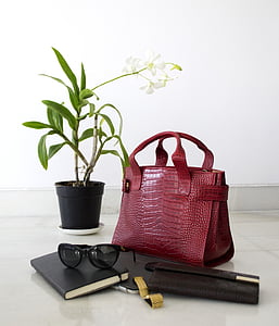 red crocodile skin leather tote bag, white moth orchid, black sunglasses, and black leather wallet thumbnail