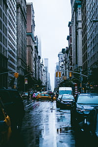 cars near building during daytime thumbnail