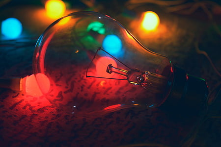 incandescent bulb on green surface thumbnail