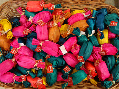 assorted-color textiles on basket thumbnail