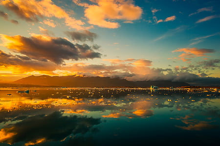 body of water during golden hour thumbnail