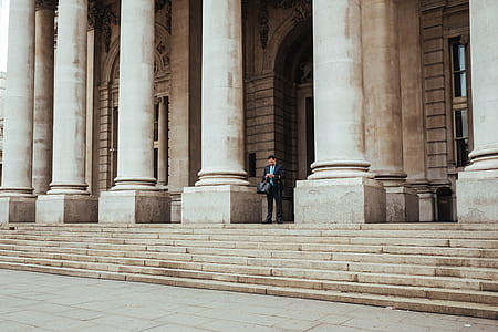 man standing at front of doorway thumbnail