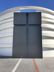 White and Black Concrete Building Under Blue Sky thumbnail