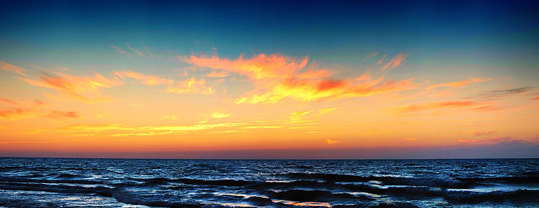 sun set and body of water thumbnail