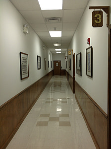 empty hallway with frames on wall thumbnail