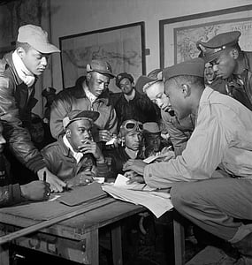 grayscale photography of group of men with papers thumbnail