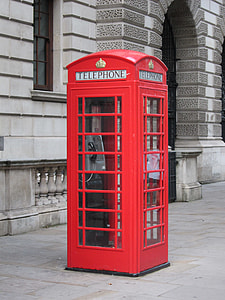 selective photo of telephone boots near concrete structure thumbnail