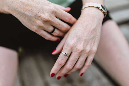 Detail of woman's hands and jewelry thumbnail