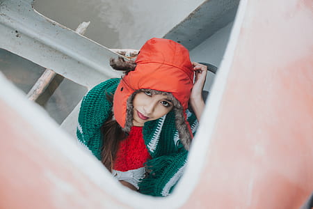 Woman Wearing Orange Snow Hat thumbnail