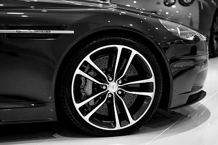 photography of chrome-colored 5-spoke vehicle wheel and tire thumbnail