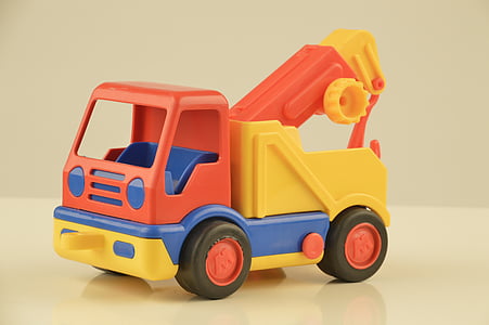 orange, yellow, and blue truck toy thumbnail