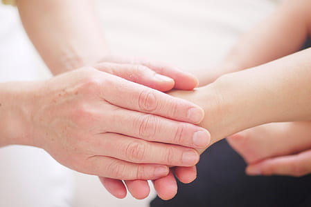 two persons holding hands thumbnail