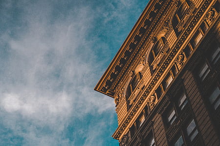low angle photo of brown concrete building thumbnail