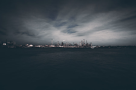 city can be seen near body of water thumbnail