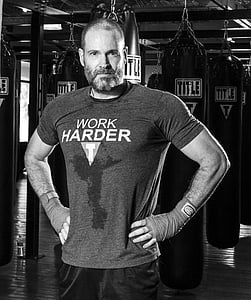 grayscale photo of man in gym thumbnail