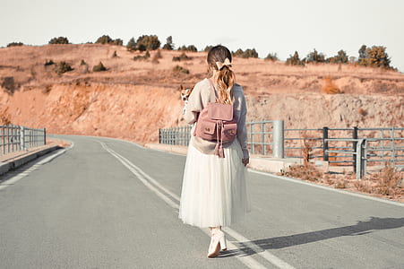 woman walking on highway thumbnail