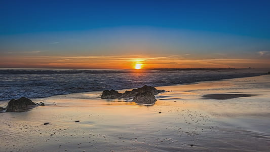 calm body of water during sunset thumbnail