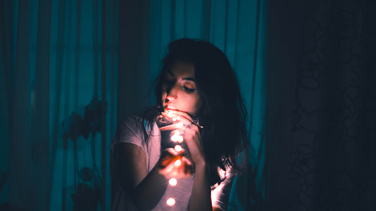 women's wearing pink collard shirt inside room thumbnail