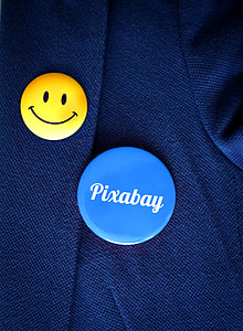 yellow and blue pins on blue textile thumbnail