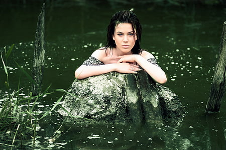 woman on body of water during daytime thumbnail