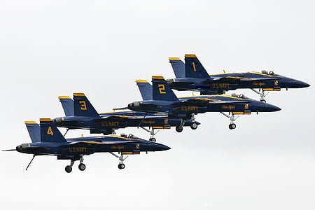 four flying blue jet planes thumbnail