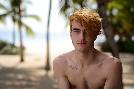shallow photography of man with brown hair thumbnail