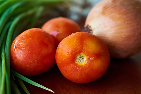 three tomatoes on brown surface thumbnail