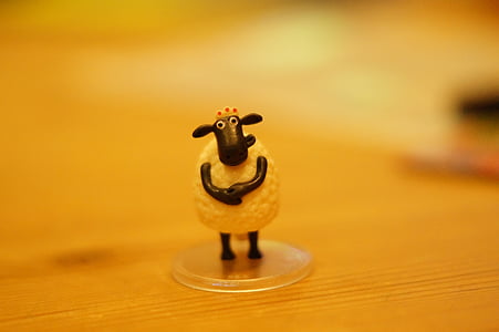 sheep figurine in selective focus photography thumbnail