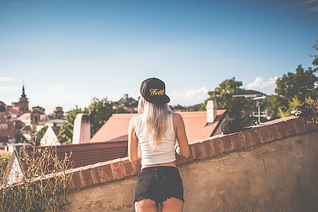 Young Girl with Snapback Looking over the Old City thumbnail