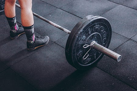 Person Standing Near Black Barbell thumbnail
