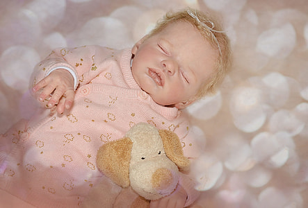 baby sleeping wearing pink sleeper thumbnail