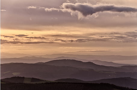 mountain range under cloudy sky thumbnail