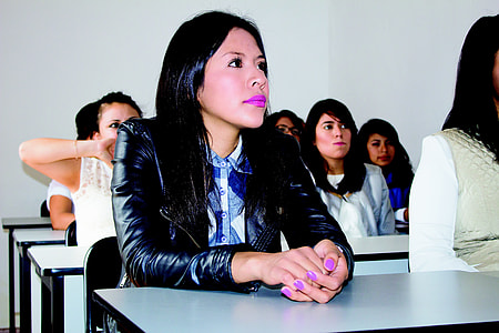 woman sitting in front of desk thumbnail